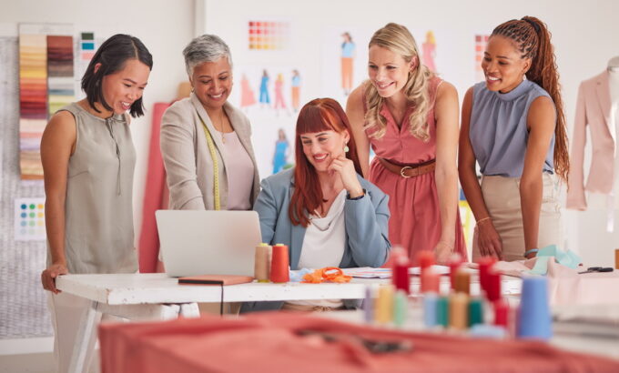 business-people-laptop-and-fashion-meeting-for-ma-2022-12-23-00-55-33-utc Business people, laptop and fashion meeting for marketing, clothing or ecommerce at the office. Gro.